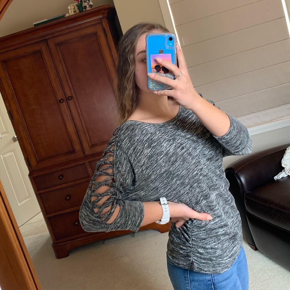 Grey long sleeved shirt w/ criss-cross on sleeves